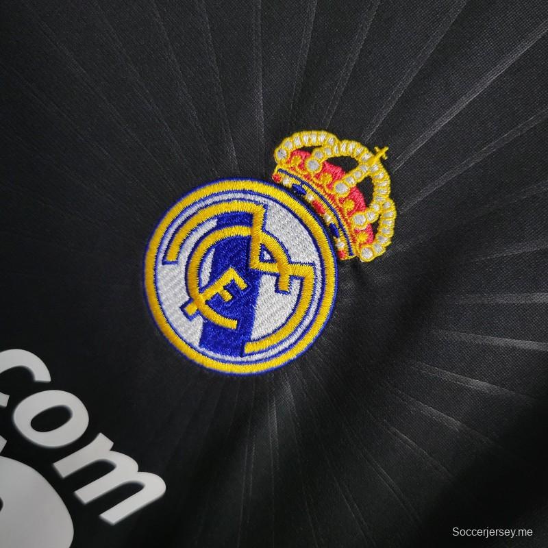 قميص كرة قدم ريترو 10-11 ريال مدريد ذهاباً وإياباً أسود بأكمام طويلة
