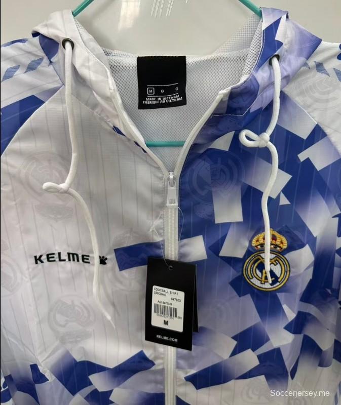 25/26 ريال مدريد سترة واقية من الريال أبيض بنقشة هندسية زرقاء