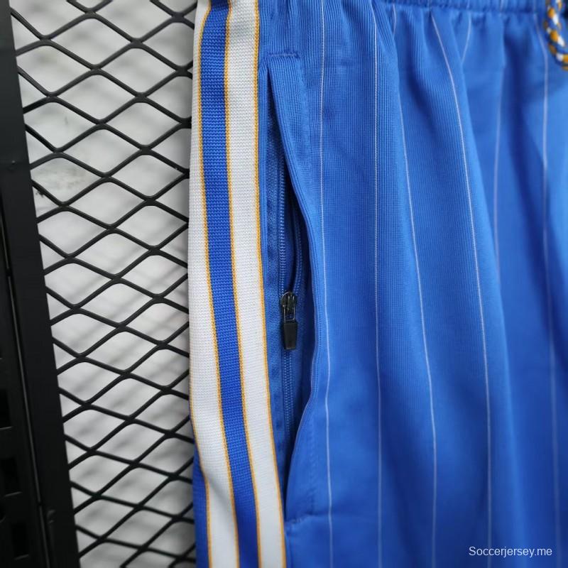 25/26 شورت ريال مدريد أزرق بخطوط بيضاء مقلمة