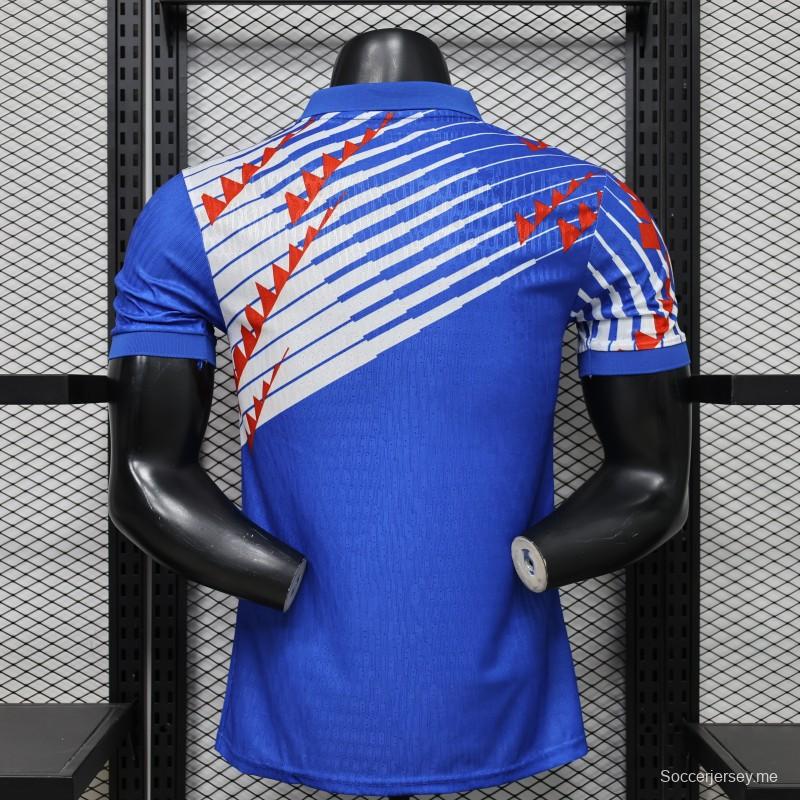 قميص اللاعب الإصدار 2027، النسخة اليابانية، أزرق مع تصميم قطري