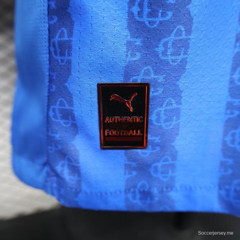 قميص اللاعب رقم 26/27 لفريق تشيفاس غوادالاخارا (قميص خارجي أزرق بنمط خطوط داكنة)