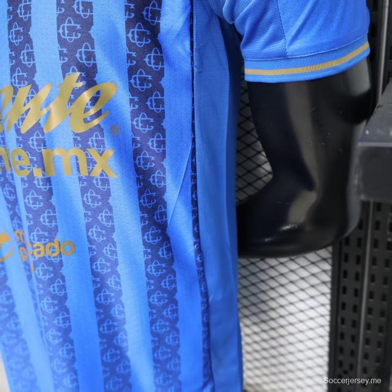 قميص اللاعب رقم 26/27 لفريق تشيفاس غوادالاخارا (قميص خارجي أزرق بنمط خطوط داكنة)