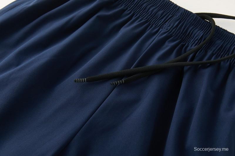 26/27 بدلة رياضية من ريال مدريد باللون الأزرق الداكن مع سترة واقية من الرياح بغطاء للرأس وسحاب كامل + بنطال طويل