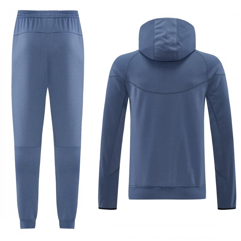 26/27  طقم رياضي من باريس سان جيرمان باللون الأزرق الفولاذي مع سترة بغطاء رأس وسحاب كامل + بنطال طويل
