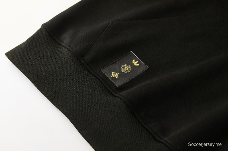 26/27 مانشستر يونايتد - بدلة رياضية سوداء بغطاء رأس وبنطال طويل