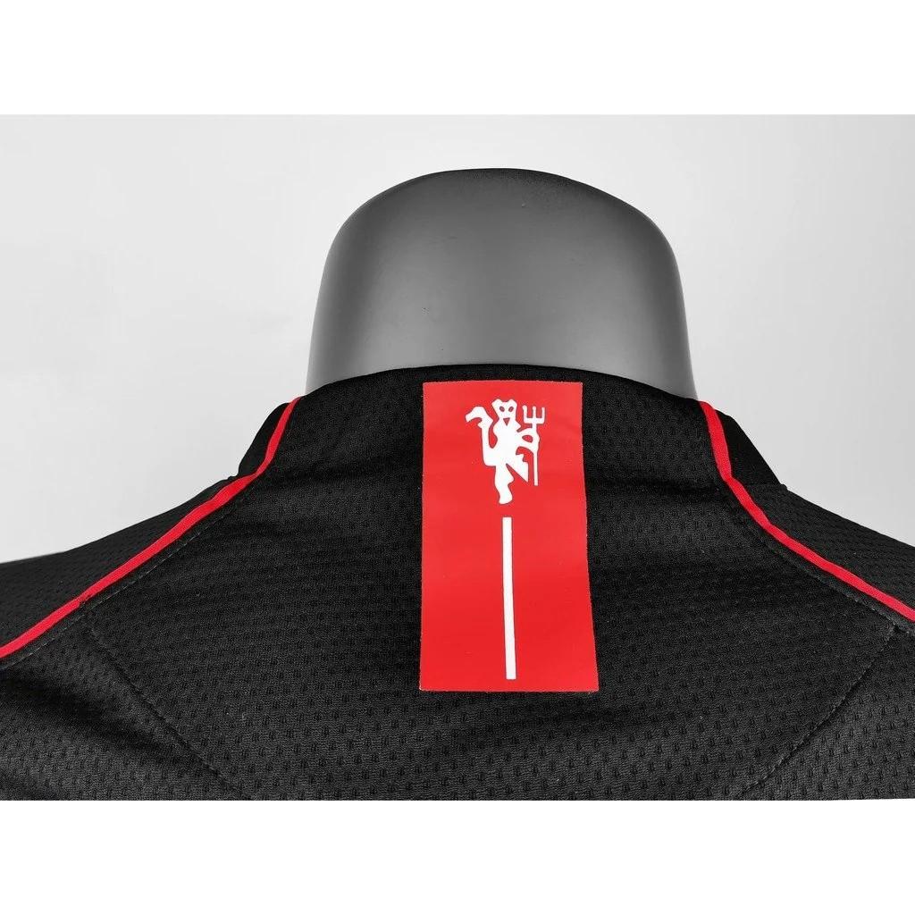 قميص ريترو 07/08 مانشستر يونايتد ذهاباً وإياباً أسود طويل الأكمام
