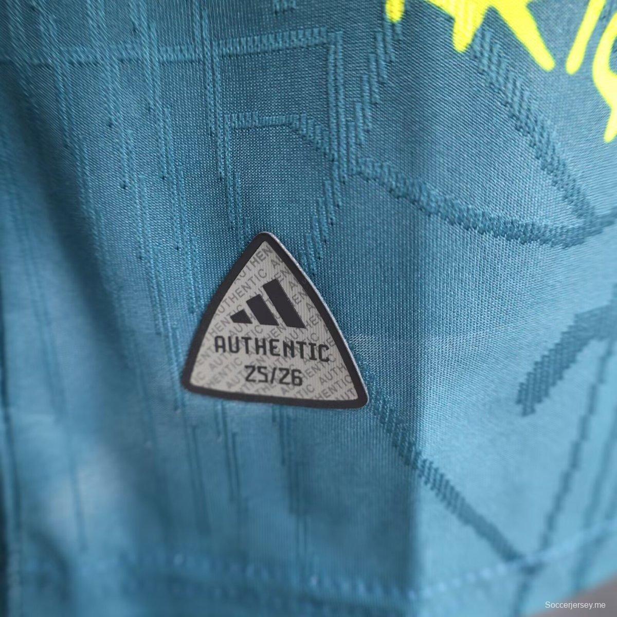 قميص أجاكس 25/26 أزرق داكن مع قميص بوب مارلي التذكاري